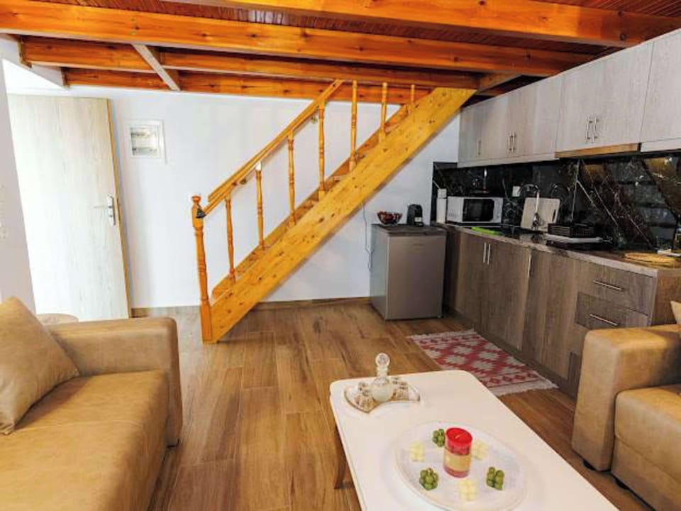 Living area with stairs leading to the upper level