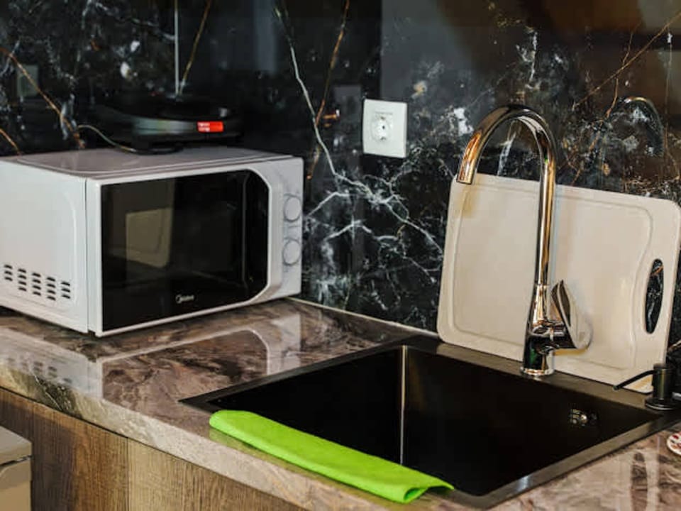 Kitchen counter with sink and appliances