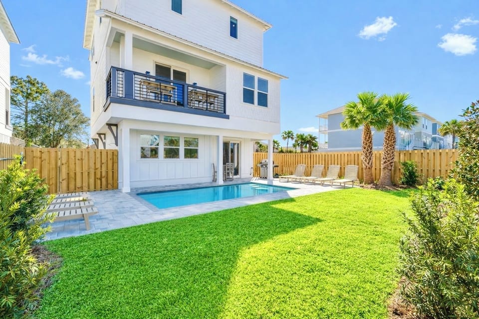 Aquadisiac—your perfect group getaway that SLEEPS 22! Just steps from the beach, this stunning retreat includes a FREE golf cart. Unwind in the backyard oasis with a HEATED pool, outdoor kitchen, and lounge seating.
