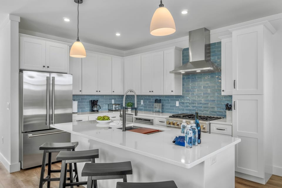 1st Floor - Gourmet chef’s kitchen featuring premium GE Monogram appliances and a 6-burner gas stove—perfect for cooking for a crowd