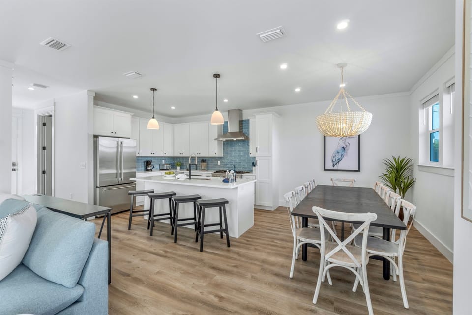 1st Floor - Spacious dining room with seating for 10 plus additional seating for 4 at the kitchen island—ideal for group meals