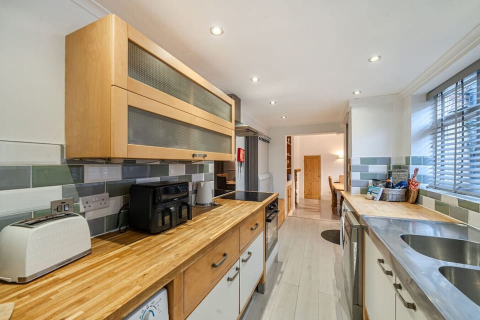 Use the extended worktop space for preparing meals in the kitchen.