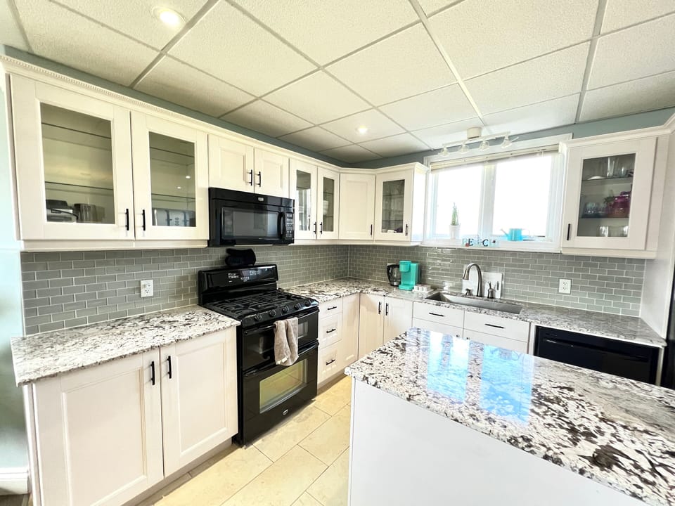 Gas stove, dishwasher and full size fridge.