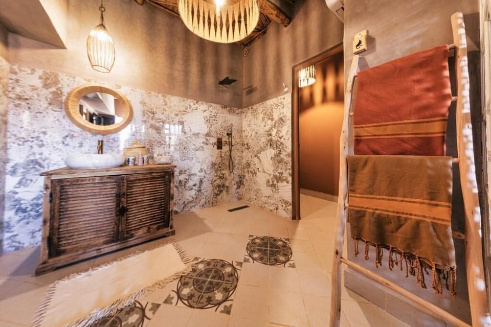 Designer toiletries, hair dryer, towels, soap