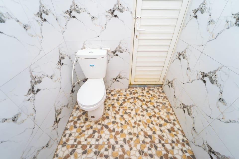 Economy Double Room | Bathroom | Shower, towels, soap