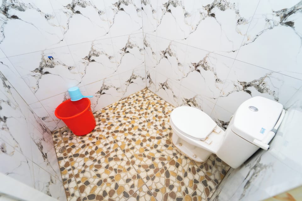 Economy Double Room | Bathroom | Shower, towels, soap