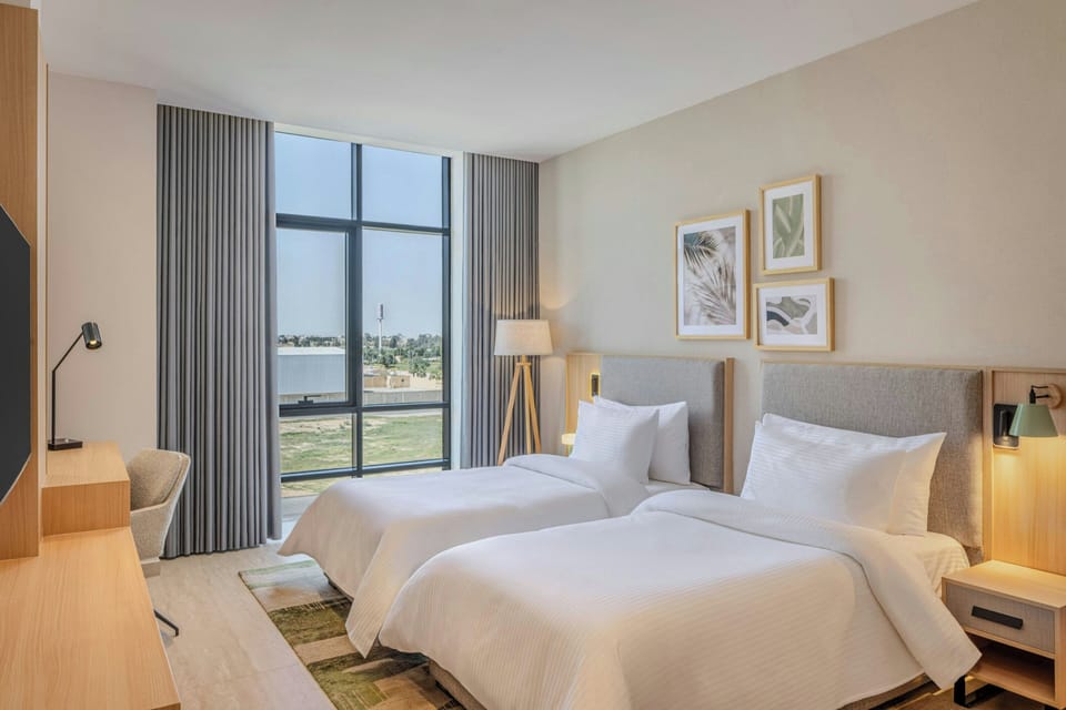 City Room, 2 Twin Beds, City View | Premium bedding, in-room safe, free cribs/infant beds, rollaway beds
