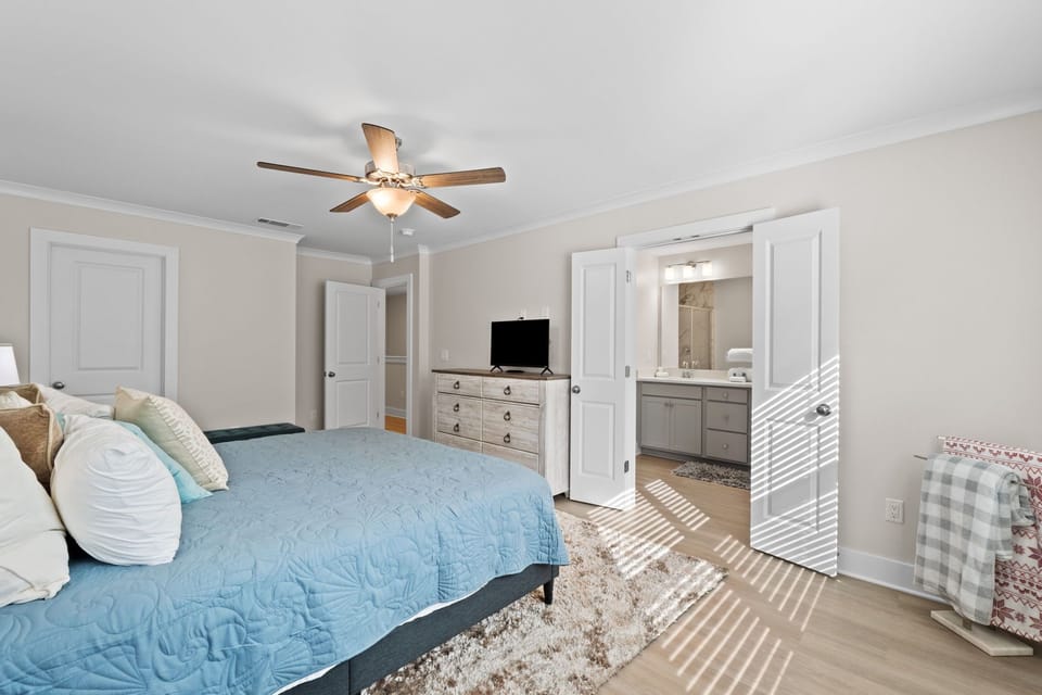 Gorgeous master bedroom with a king bed, en-suite bathroom, and smart TV