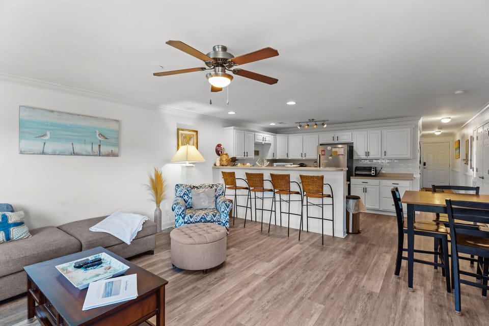 Living Room w/ Kitchen, Breakfast Bar, and Dining Table