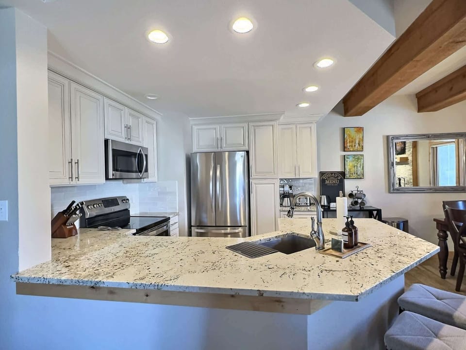 Renovated modern and well stocked kitchen | Listed with @BookTraverse