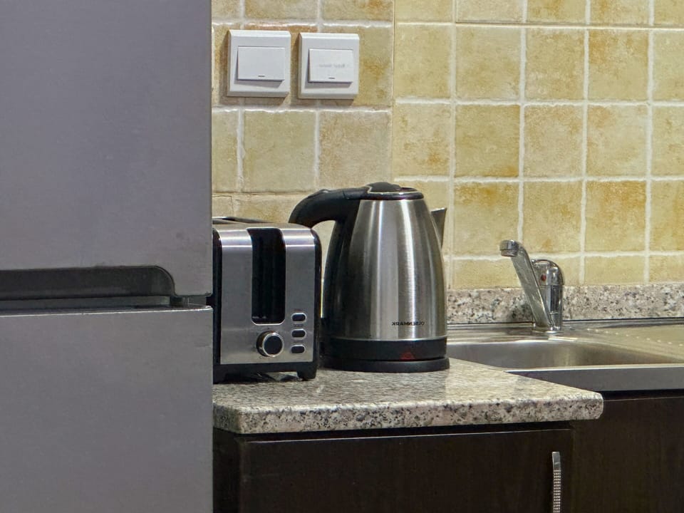 Apartment, 1 Bedroom, Non Smoking, City View | Private kitchen | Coffee/tea maker, full-size fridge, electric kettle