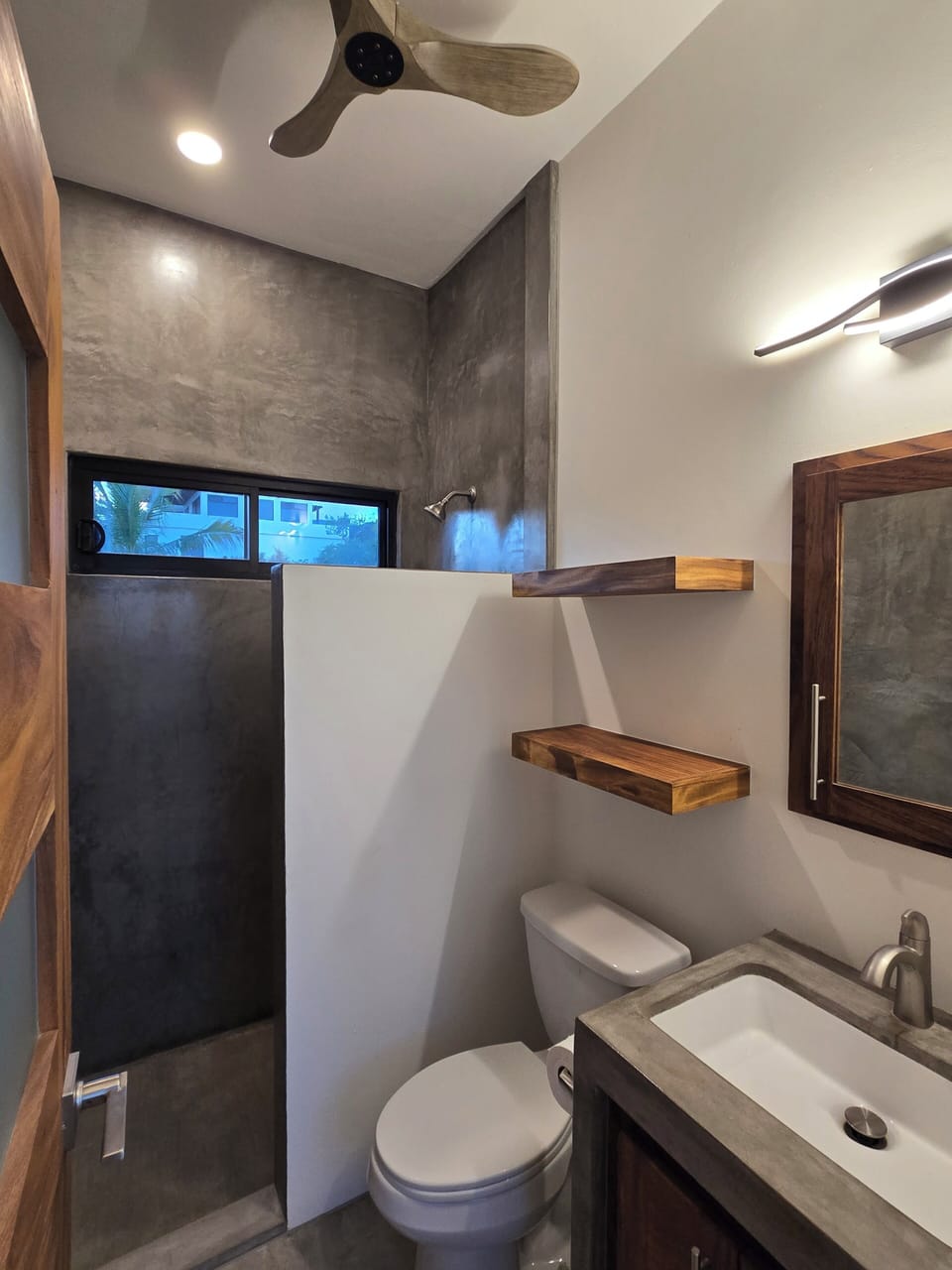 Bath 2. walk in shower with ceiling fan. The hair dryer is in the cabinet. 