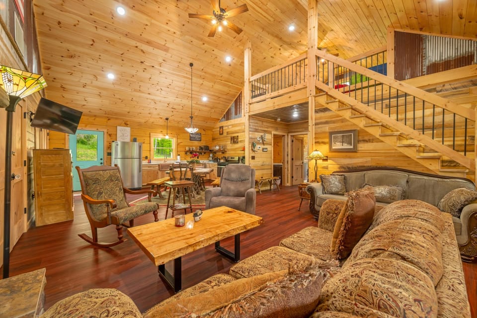 Cozy living room with rustic charm and loft views