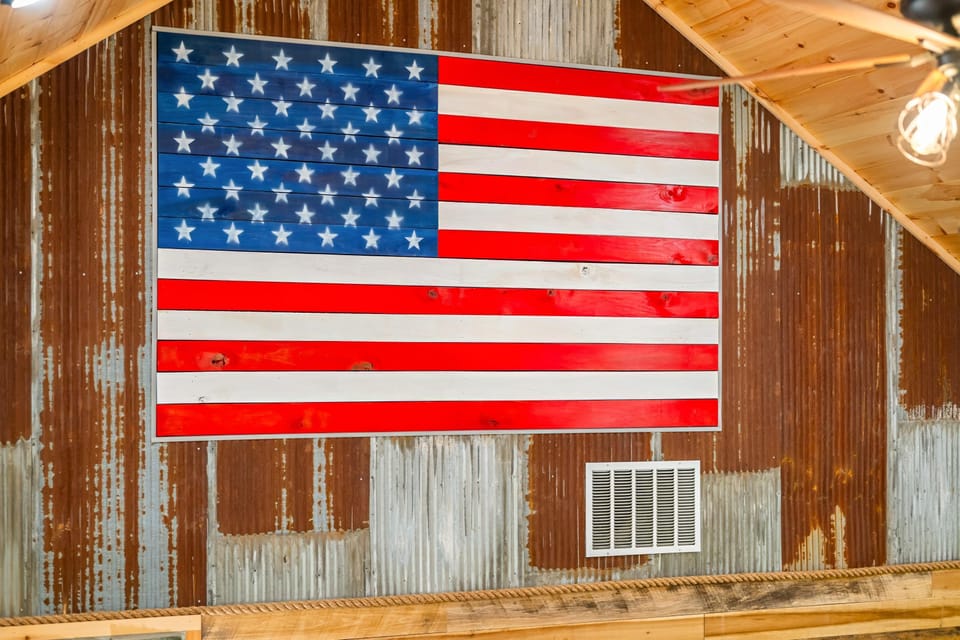 Rustic loft with striking oversized American flag decor