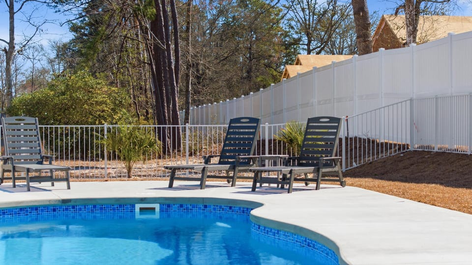 Sun-soaked poolside retreat with ample lounge seating
