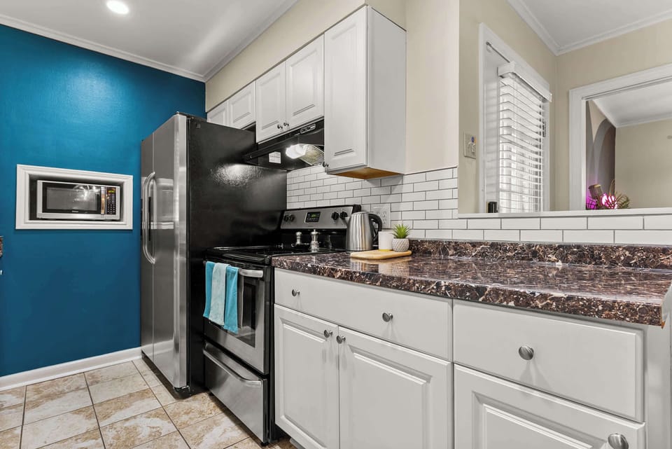A full stainless steel range and plenty of counter space make this kitchen ready for anything, from morning coffee to a home-cooked feast.