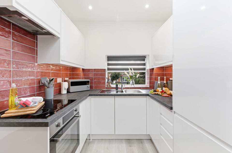 The kitchen is fully equipped with all the appliances, cookware, and utensils needed to prepare delicious home-cooked meals during your stay.