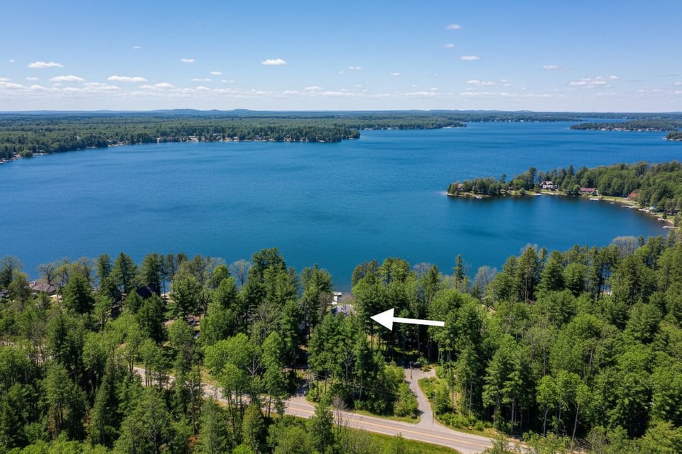 A drone shot capturing the beauty of Long Lake while also highlighting how far off the road the house is. The long driveway and the wooded lot combined to cut down on potential road noise.