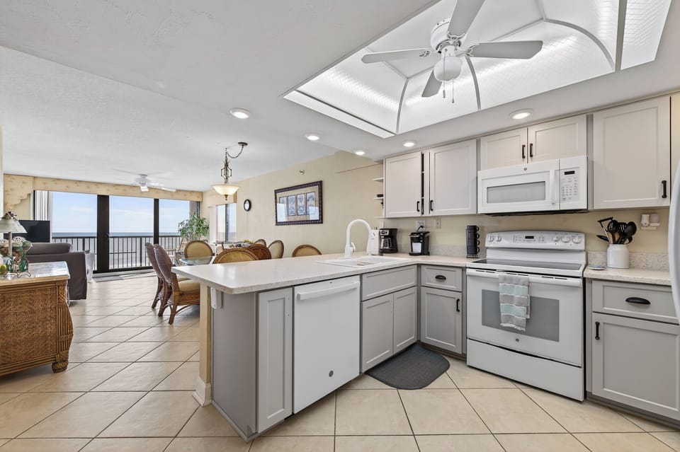 Open kitchen with plenty of counter space for easy vacation cooking.