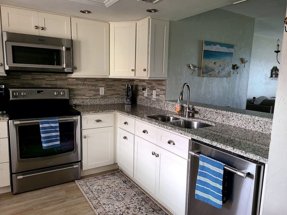 Cookware, utensils, mixing bowls, flatware, dishes, cups and glasses included.