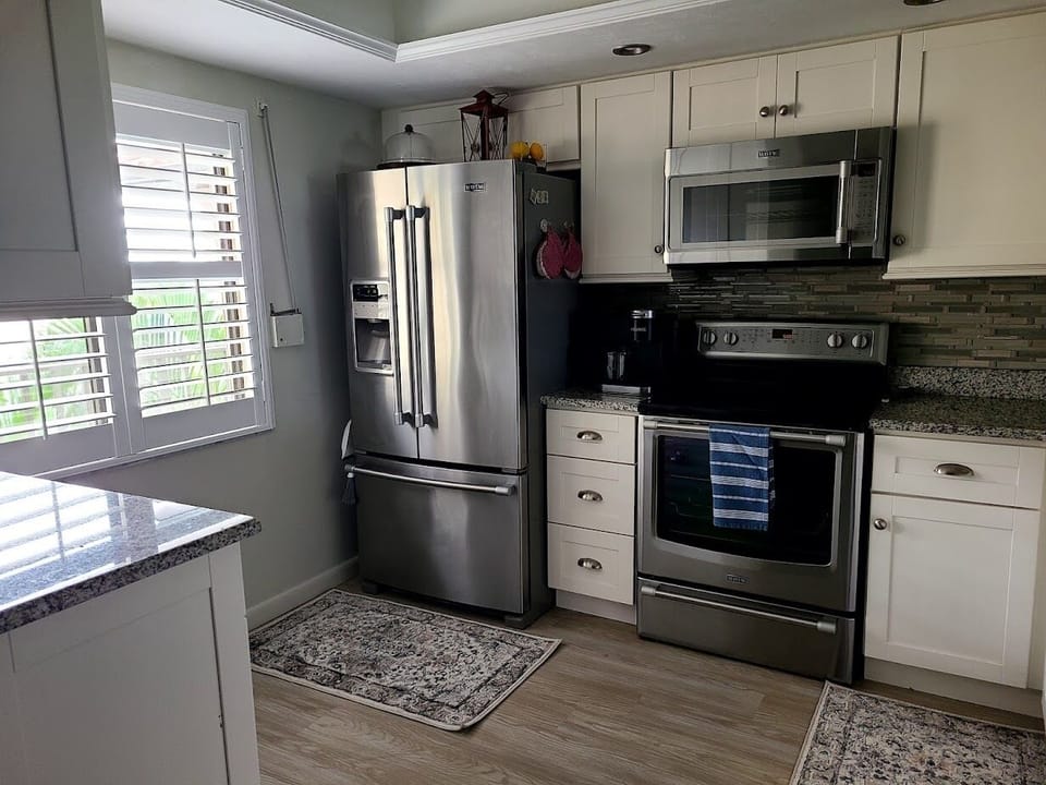 Frig/icemaker, stove, microwave, dishwasher, toaster oven, Kurig coffee pot