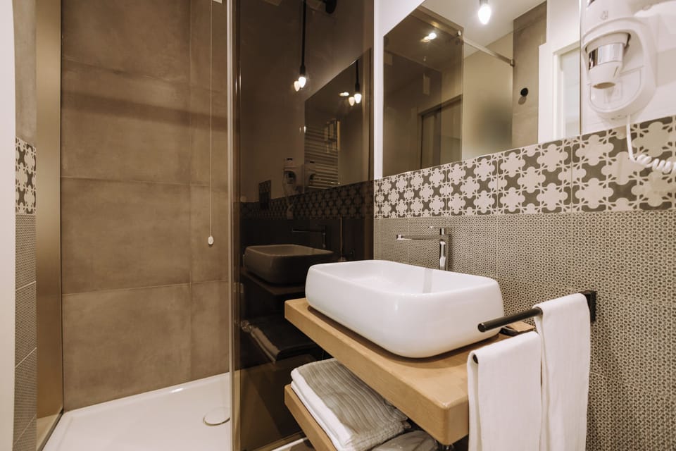 Shower, free toiletries, hair dryer, slippers