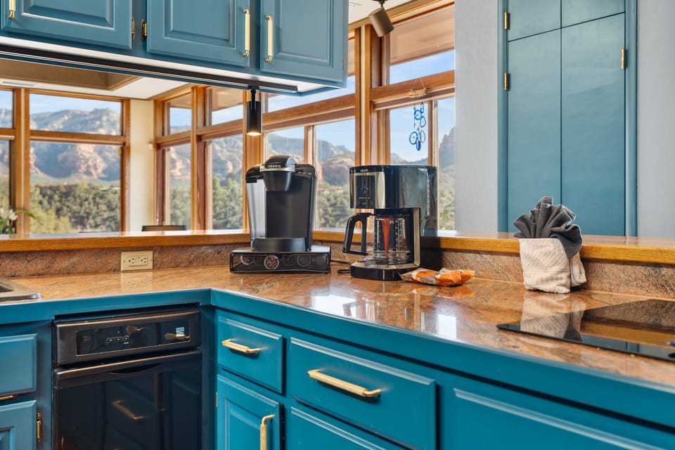 Kitchen amenities includes two types of coffee makers