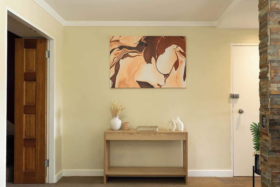 Entryway Elegance: A stylish welcome with artistic decor and natural accents!