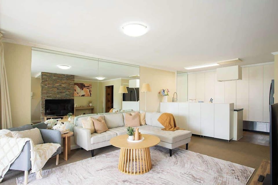 Living Room: Relax and unwind in this stylish space with modern decor and a warm atmosphere.