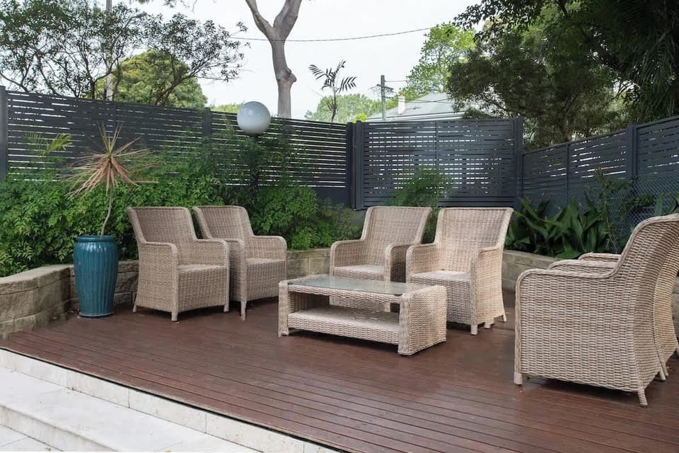 Outdoor Oasis: Relax in style on the deck with lush greenery and inviting seating!
