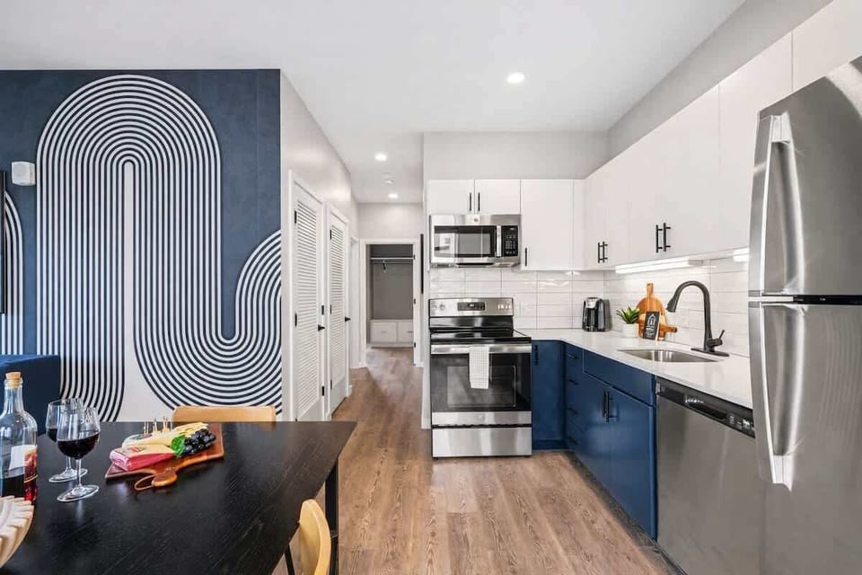Fully equipped kitchen stocked with your basic cooking essentials, stainless steel appliances, and a dining table for 4.