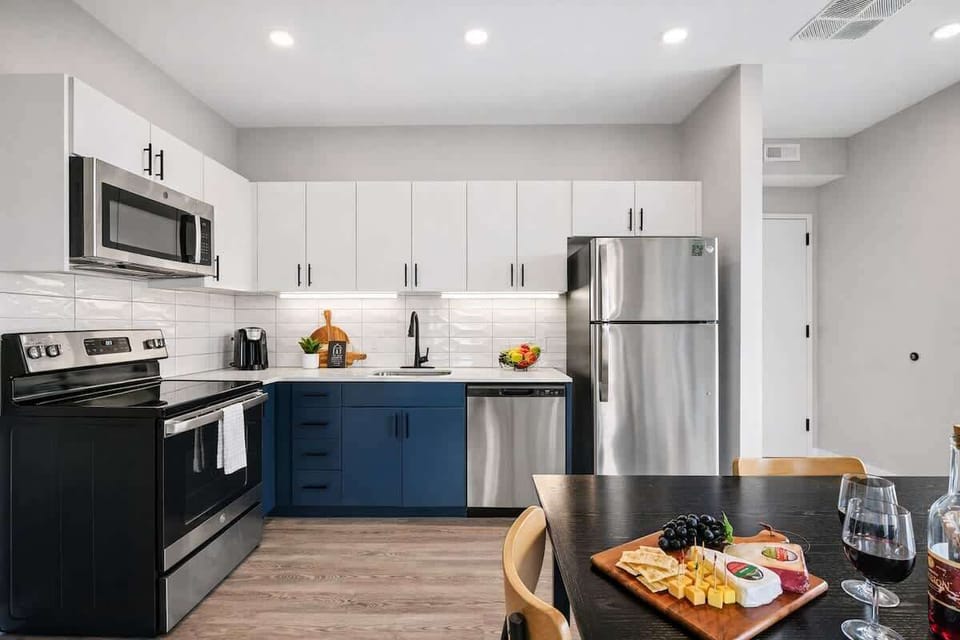Fully equipped kitchen stocked with your basic cooking essentials, stainless steel appliances, and a dining table for 4.