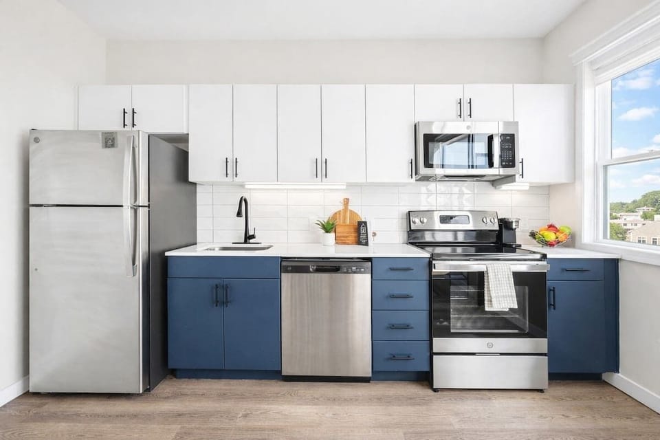 This modern kitchen features sleek stainless steel appliances and all the essentials you need for a comfortable and convenient stay.