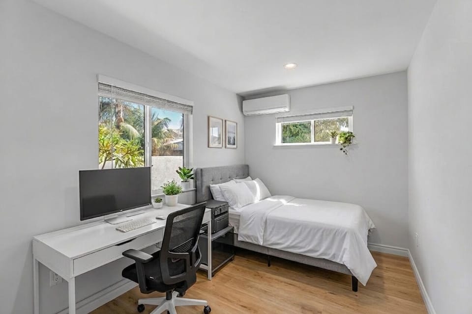 Second bedroom with dedicated workspace — perfect for remote work or studying", 