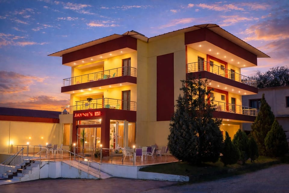 Property exterior at sunset—quiet, central location in Elassona.