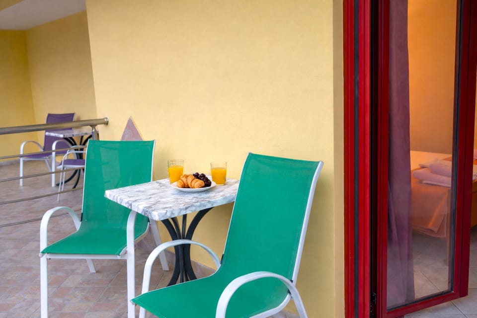 Private balcony with outdoor seating—perfect for morning coffee and fresh air.