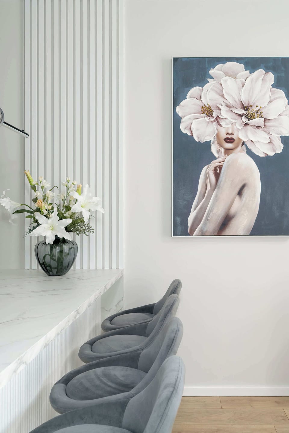 Living room detail with flowers and minimalist décor accents.