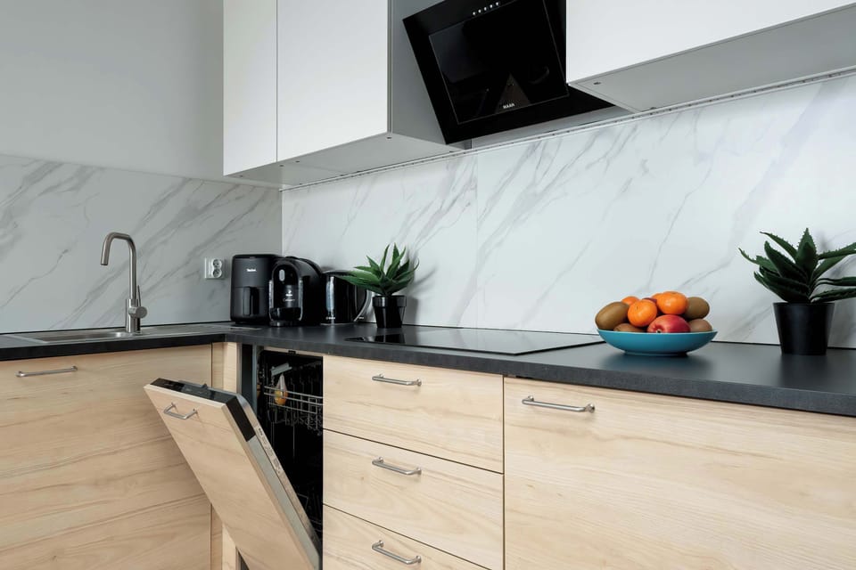 Kitchen countertop with coffee machine and appliances, ready for daily use.