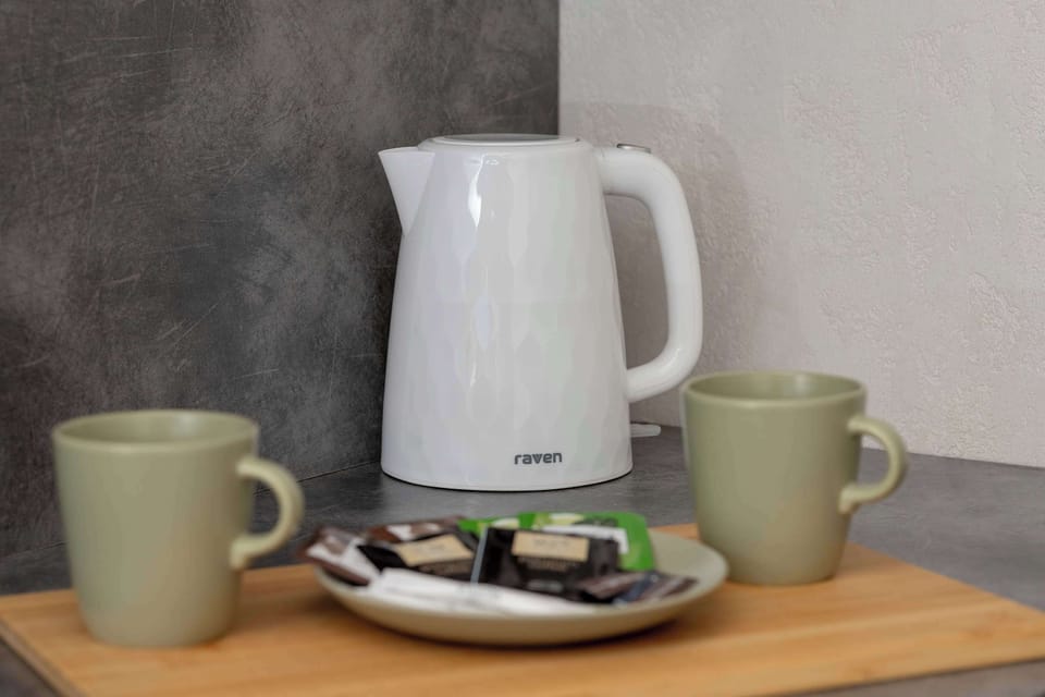 Coffee and tea set with kettle.