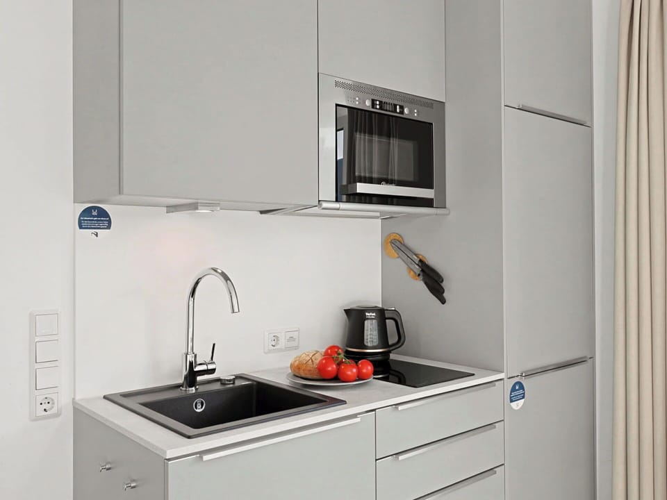 Kitchen, Cabinetry, Countertop, Kitchen Appliance, Furniture, Interior Design, Major Appliance, Flooring, Kitchen Sink, Home Appliance