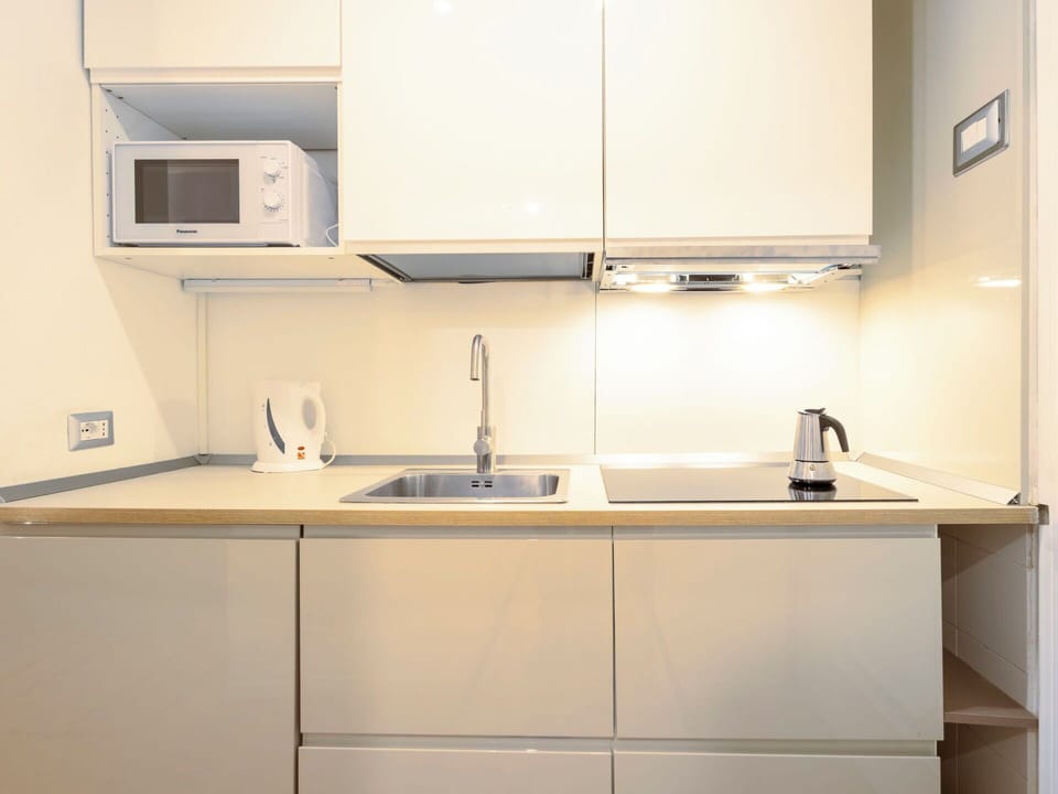 Kitchen, Countertop, Kitchen Appliance, Cabinetry, Major Appliance, Interior Design, Kitchen Sink, Sink, Plumbing Fixture, Tap