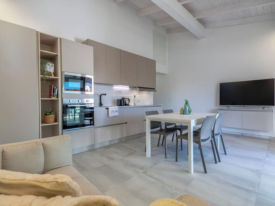 Flooring, Interior Design, Furniture, Floor, Ceiling, Room, Kitchen, Countertop, Wood Flooring, Living Room