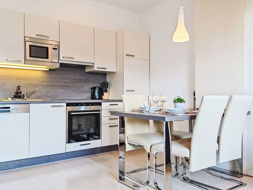 Furniture, Interior Design, Flooring, Wood, Floor, Kitchen Appliance, Kitchen, Ceiling, Countertop, Room