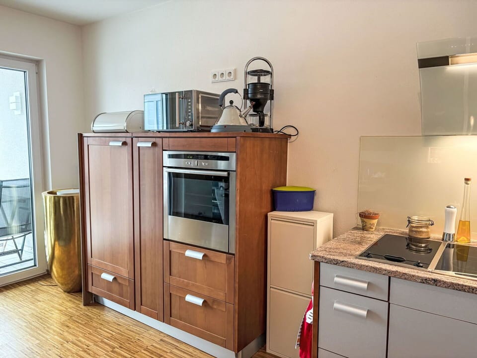 Kitchen Appliance, Major Appliance, Cabinetry, Kitchen, Flooring, Furniture, Countertop, Wood, Home Appliance, Interior Design