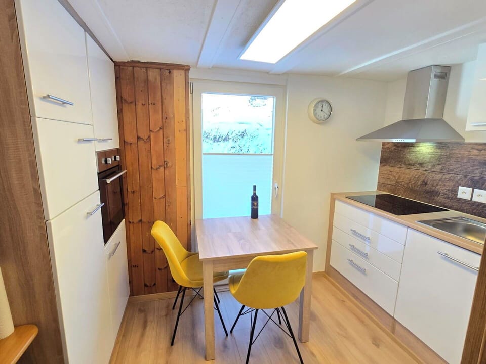 Furniture, Interior Design, Flooring, Floor, Wood, Wood Flooring, Room, Countertop, Ceiling, Cabinetry