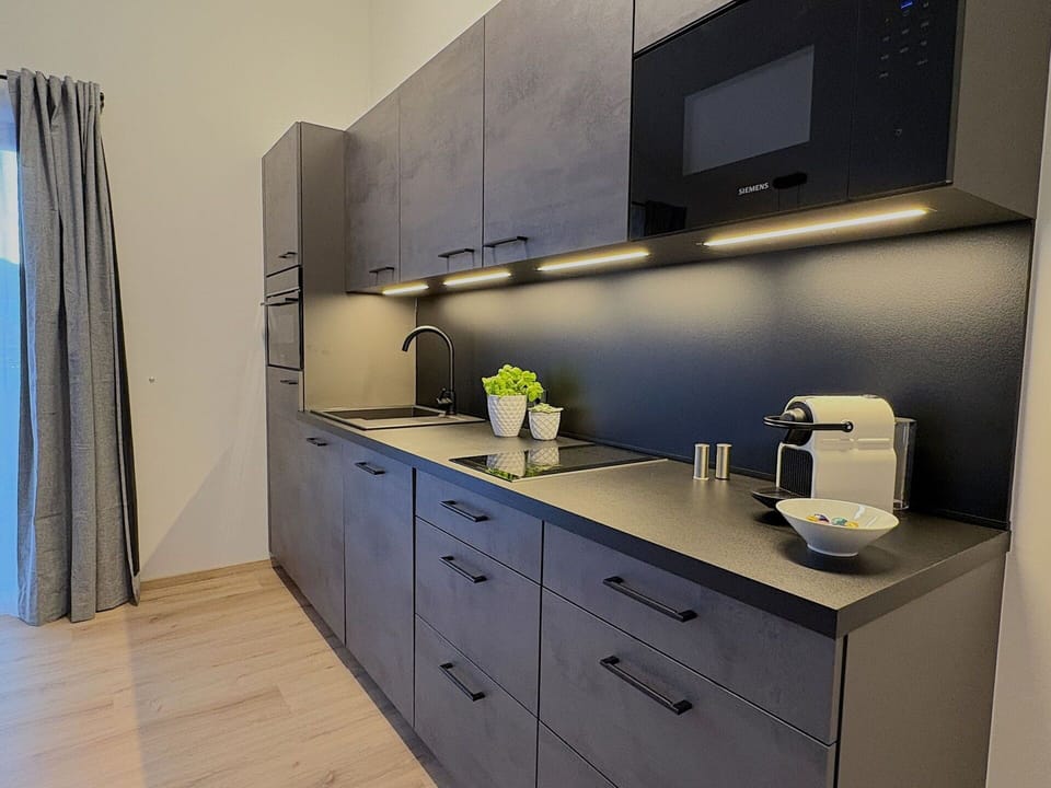 Countertop, Kitchen, Cabinetry, Interior Design, Flooring, Kitchen Appliance, Major Appliance, Furniture, Drawer, Home Appliance