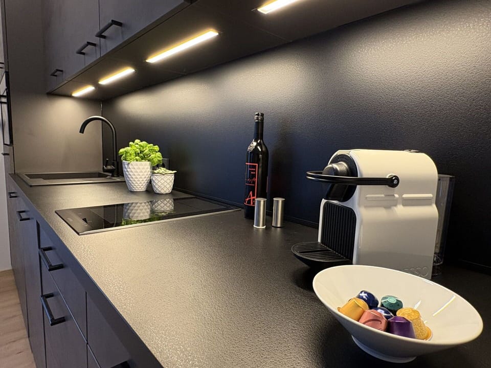 Kitchen, Lighting, Black, Interior Design, Countertop, Light Fixture, Tap, Cabinetry