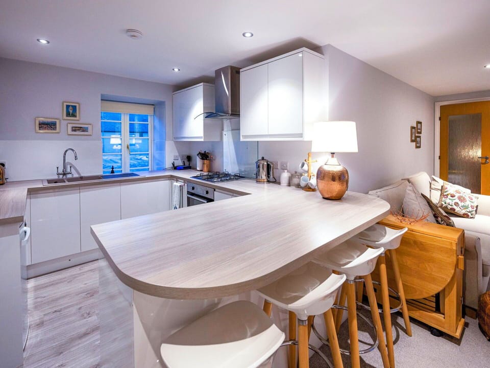 Furniture, Interior Design, Flooring, Wood, Floor, Kitchen, Countertop, Ceiling, Cabinetry, Room