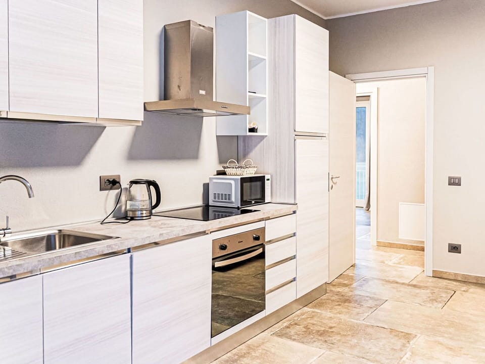 Cabinetry, Flooring, Countertop, Furniture, Kitchen, Kitchen Appliance, Interior Design, Wood, Major Appliance, Floor