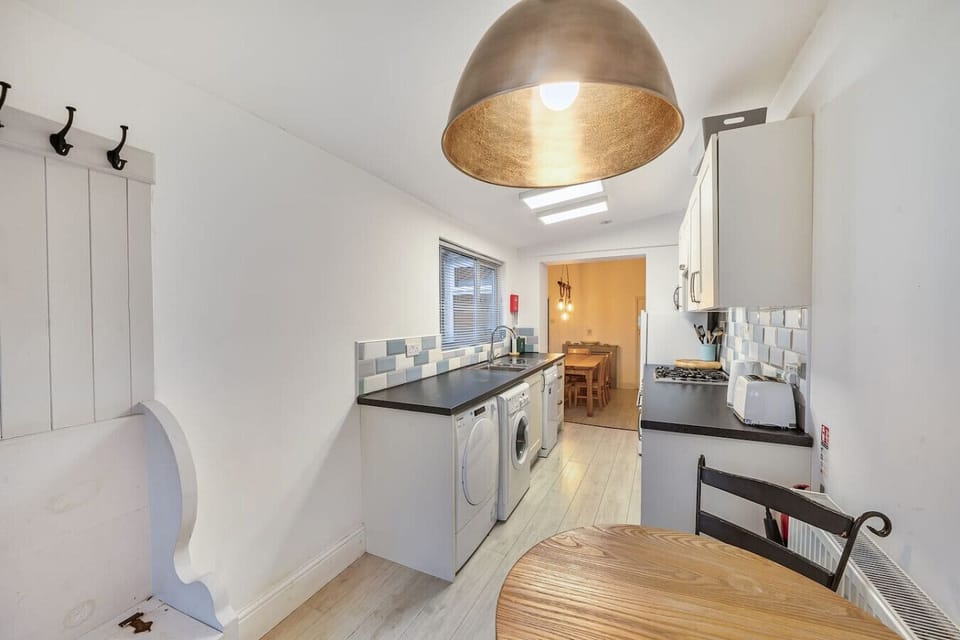 A second view of the kitchen showing the dining area beyond the counters.
